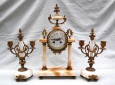 A 19th century French faux marble clock garniture,