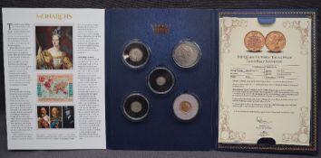 A Monarchs gold, silver and nickel five coin set,