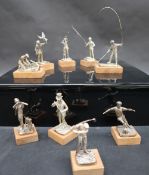 A set of nine Elizabeth II silver sportsmen figures including The Falconer, The Squire, The Poacher,