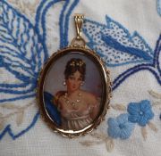 A 9ct gold portrait miniature pendant / brooch, depicting a lady wearing gem set jewellery,