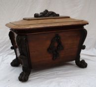 An early Victorian mahogany sarcophagus wine cooler the hinged octagonal top with a carved