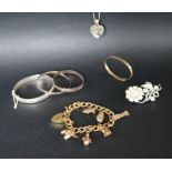 Various 9ct gold charms on a gold plated bracelet together with a 9ct gold christening bracelet