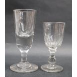 A 19th century wine glass with a tapering deceptive bowl on a waisted column and spreading foot, 13.