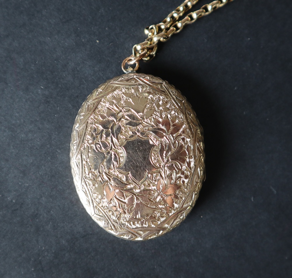 A yellow metal locket of oval form on a 9ct gold chain, - Image 5 of 5