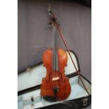 A violin with a one piece back and ebony stringing, bears a label for Louis Noebe, Homborg,