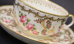 A Swansea porcelain tea cup and saucer painted with roses in a gilt garland border, 9.