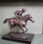 David Cornell Champion Finish A bronze statue of a racehorse and jockey on a rectangular marble