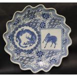 An oriental porcelain charger of shaped circular form,