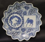 An oriental porcelain charger of shaped circular form,