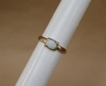 A 9ct yellow gold ring set with an oval opal, size S 1/2,