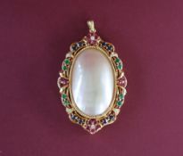 An 18ct yellow gold pendant set with diamonds, rubies, sapphires and emeralds,