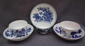 A pair of 18th century Worcester porcelain tea bowls and saucers decorated in the birds in branches