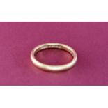 An 18ct yellow gold wedding band, size L,