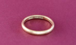 An 18ct yellow gold wedding band, size L,