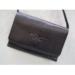 A Prada black leather clutch bag, the interior with card slots, zip purse, id windows etc,
