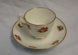 A Swansea porcelain teacup and saucer decorated with roses, London shape,