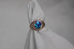 A 9ct yellow gold fire opal and diamond ring,