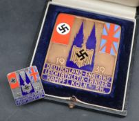 An enamelled bronze plaque depicting the Nazi Party Flag and the Union Flag flanking blue enamel