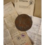 A World War I bronze Memorial plaque (Dead Man's Penny) issued to Alfred Edward George Hanks,