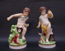 A pair of continental porcelain figures of cherubs,