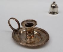 A George III silver taper stick with a ribbed column, ring handle and oval drip tray, London, 1824,