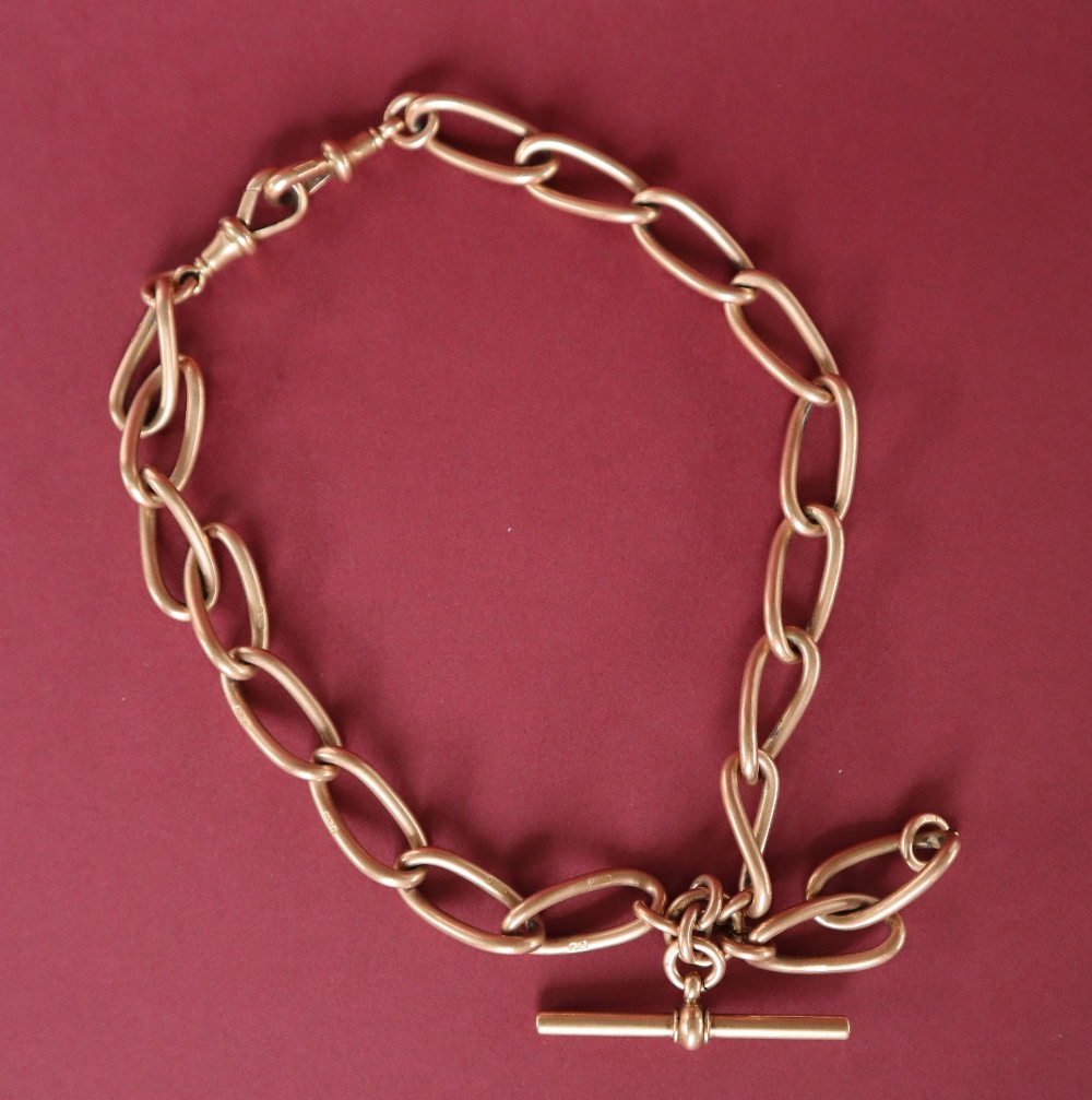 A 9ct yellow gold double Albert chain, with individually hallmarked twisted oval links, and bar,