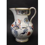A Meissen porcelain jug with underglaze blue flowers and leaves,