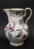 A Meissen porcelain jug with underglaze blue flowers and leaves,