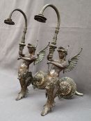 A pair of bronze wall mounted gas lights in the form of a winged mermaid,