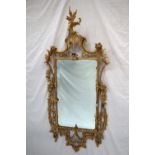 An 18th century gilt gesso wall mirror,