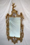 An 18th century gilt gesso wall mirror,