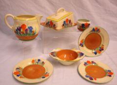 A Clarice Cliff Crocus pattern cheese dish and cover together with a similar jug,