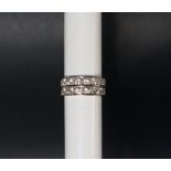 A diamond half eternity ring set with fourteen round old cut diamonds in two lines side by side,