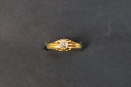 An 18ct yellow gold ring set with a cushion cut diamond, 5mm x 4mm, size O 1/2,