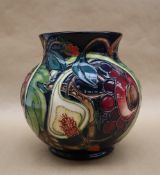 A Moorcroft pottery vase decorated in the "Queen's Choice" pattern, dated 2000,