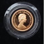 An Elizabeth II proof gold sovereign, dated 1979, encapsulated in plastic,