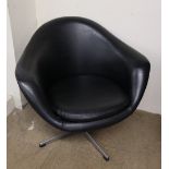 A mid-20th century Kanari black vinyl swivel chair,