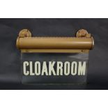 A glass overhead lit "Cloakroom" sign, 30.