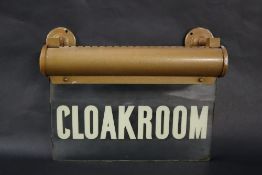 A glass overhead lit "Cloakroom" sign, 30.