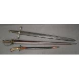 A German hunting sword with a brass pommel, an antler handle, brass hooves and shell langet,