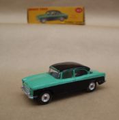 A Dinky Toys 165 Humber Hawk, with windows, black lower body and roof, pale green upper body,