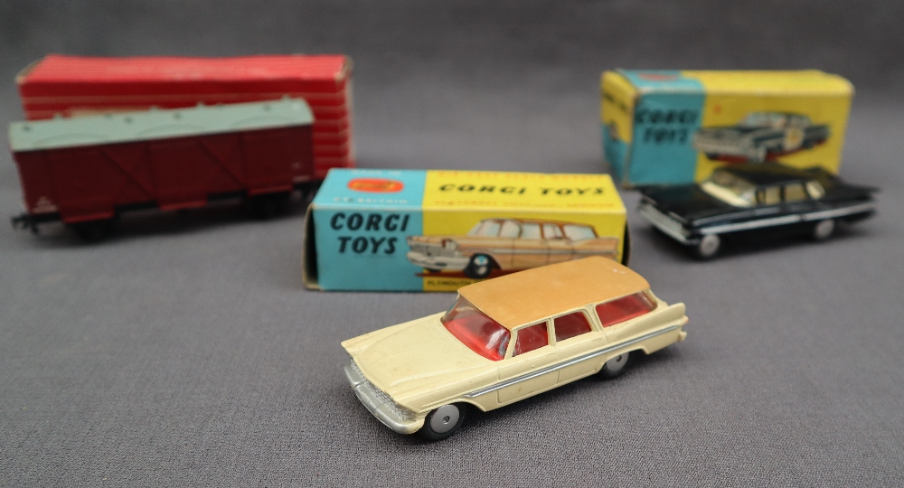 A Corgi Toys 219 Plymouth Sports Suburban Station Wagon with a brown roof,