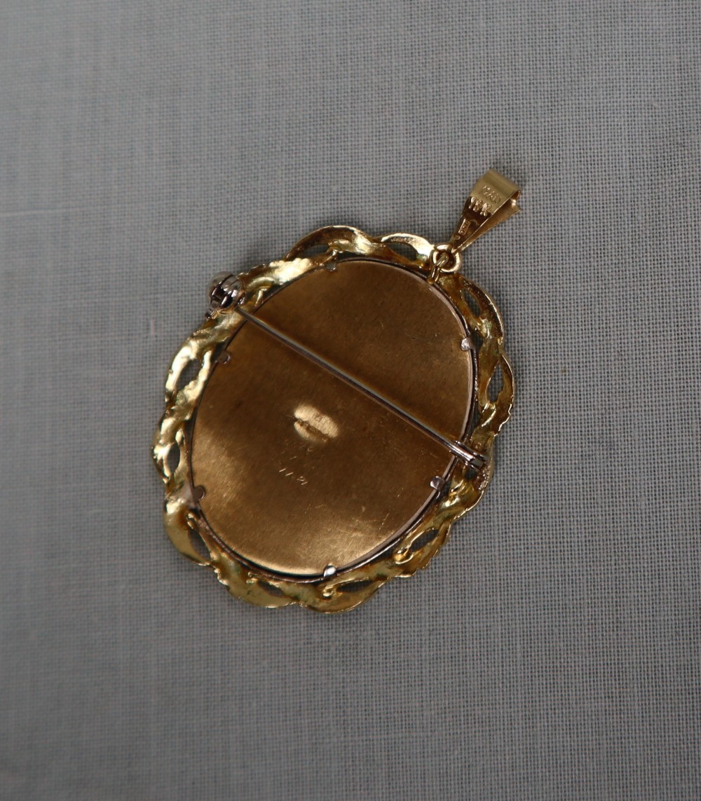 An 18ct gold portrait miniature pendant / brooch, depicting a lady with flowing brown hair, - Image 2 of 2