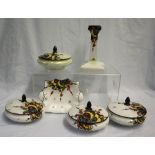 A set of four Shelley dressing table pots with lids decorated in the Balloons and Flashes pattern