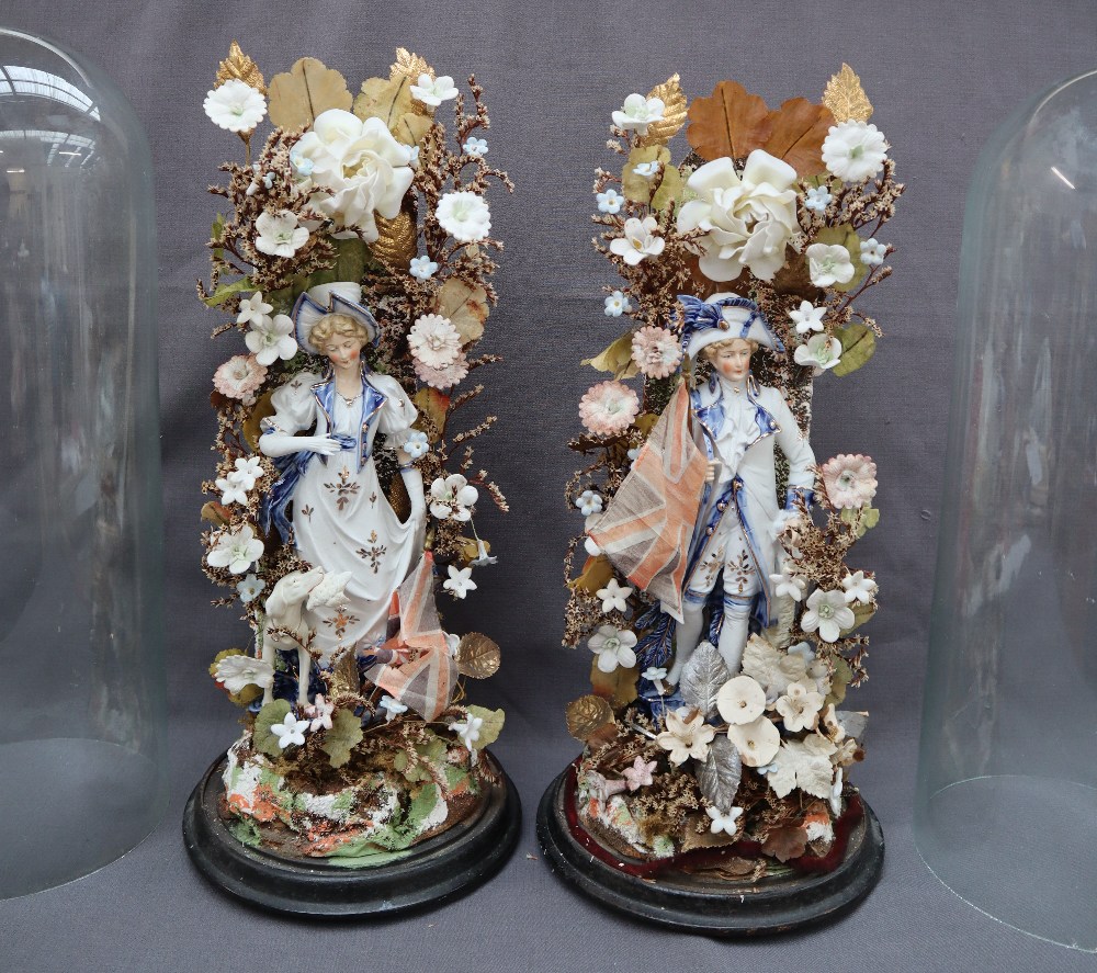 A pair of 19th century continental porcelain figures surrounded by porcelain flowers under glass - Image 2 of 7