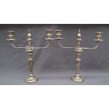 A pair of Sheffield plate twin branch candelabra with a central candle holder with vase flame