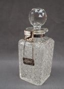 A hobnail cut glass decanter of rectangular form, with a faceted globe stopper,