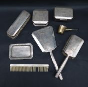 A Chinese white metal dressing table set, comprising a hand mirror, hair brush, clothes brush, comb,