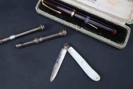 A Victorian silver bladed and mother of pearl folding knife together with a silver propelling