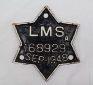 A railway wagon plate for LMS 168929 Sep-1948 of star form in black with white raised lettering,
